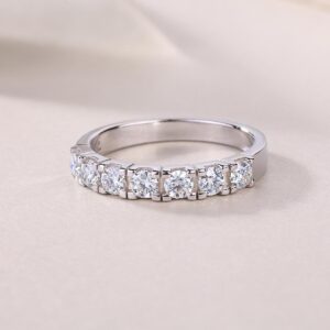 A refined seven-stone band set with shimmering 0.1-carat moissanites, each held in a sculpted claw setting that catches the light with every move. Sleek, polished, and effortlessly elegant — a modern classic crafted for everyday luxury