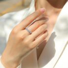 A refined seven-stone band set with shimmering 0.1-carat moissanites, each held in a sculpted claw setting that catches the light with every move. Sleek, polished, and effortlessly elegant — a modern classic crafted for everyday luxury