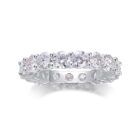 A continuous circle of 0.3-carat moissanites, each meticulously set to create an unbroken ribbon of brilliance. Sculpted with elevated prongs for maximum light play, this eternity band delivers a statement of refined sparkle and timeless elegance