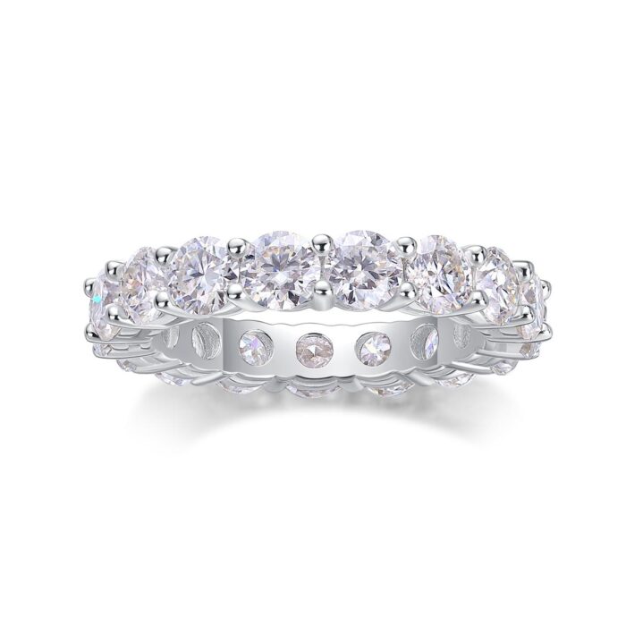 A continuous circle of 0.3-carat moissanites, each meticulously set to create an unbroken ribbon of brilliance. Sculpted with elevated prongs for maximum light play, this eternity band delivers a statement of refined sparkle and timeless elegance A continuous circle of 0.3-carat moissanites, each meticulously set to create an unbroken ribbon of brilliance. Sculpted with elevated prongs for maximum light play, this eternity band delivers a statement of refined sparkle and timeless elegance