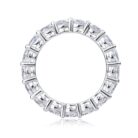 A continuous circle of 0.3-carat moissanites, each meticulously set to create an unbroken ribbon of brilliance. Sculpted with elevated prongs for maximum light play, this eternity band delivers a statement of refined sparkle and timeless elegance