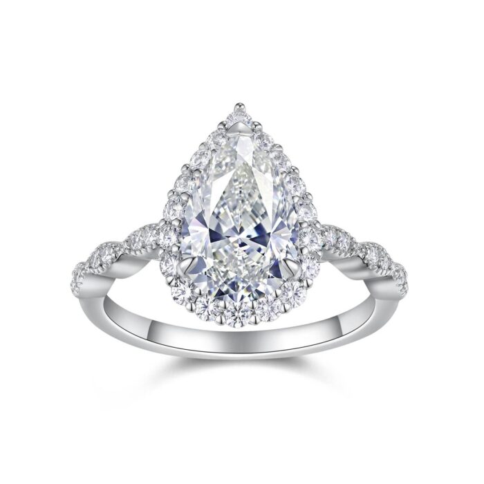 A 3-carat pear-cut moissanite that glows like liquid fire, wrapped in a halo of icy brilliance and a seductive pavé band