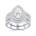 A 1.5-carat moissanite embraced by tiered halos and sculpted pavé rows ,a bold, couture statement that flashes with intense, irresistible brilliance