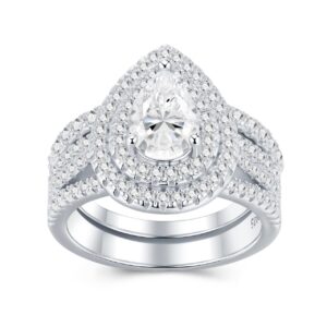A 1.5-carat moissanite embraced by tiered halos and sculpted pavé rows ,a bold, couture statement that flashes with intense, irresistible brilliance