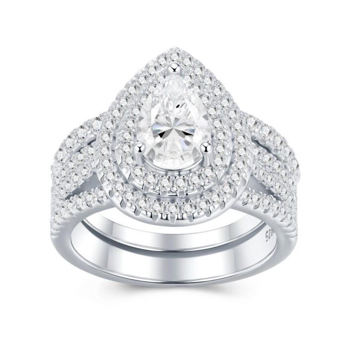 A 1.5-carat moissanite embraced by tiered halos and sculpted pavé rows ,a bold, couture statement that flashes with intense, irresistible brilliance