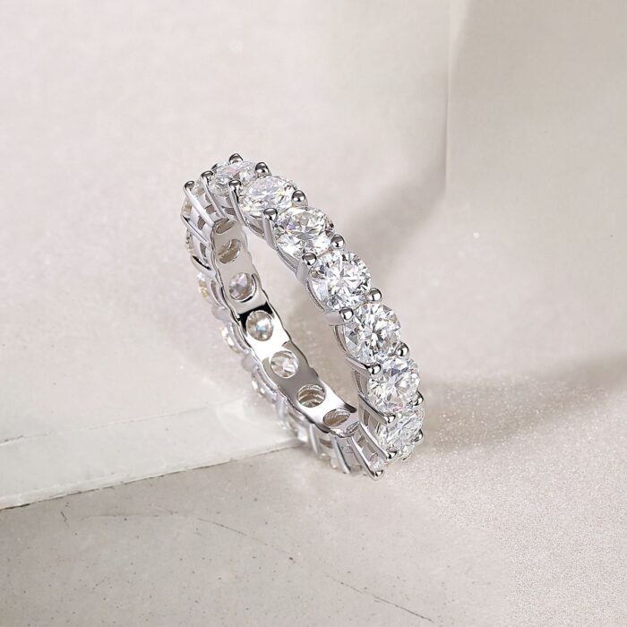 A continuous circle of 0.3-carat moissanites, each meticulously set to create an unbroken ribbon of brilliance. Sculpted with elevated prongs for maximum light play, this eternity band delivers a statement of refined sparkle and timeless elegance A continuous circle of 0.3-carat moissanites, each meticulously set to create an unbroken ribbon of brilliance. Sculpted with elevated prongs for maximum light play, this eternity band delivers a statement of refined sparkle and timeless elegance