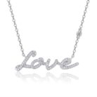 A delicate script of ‘Love’ traced in shimmering moissanites, crafted in polished silver and suspended on a fine chain for a soft, luminous sparkle. A graceful piece that captures emotion with refined elegance