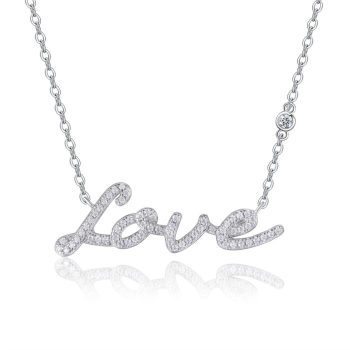 A delicate script of ‘Love’ traced in shimmering moissanites, crafted in polished silver and suspended on a fine chain for a soft, luminous sparkle. A graceful piece that captures emotion with refined elegance